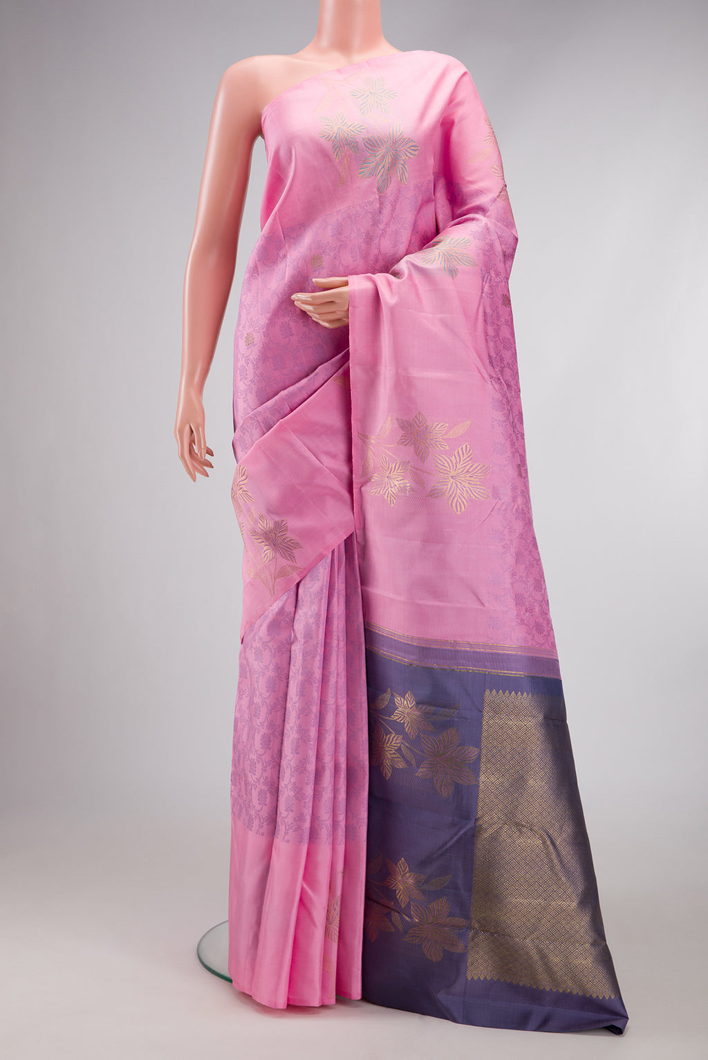 Pink Kanchipuram Silk Saree with Jacquard design on the body and Fancy Border.  displayed on a mannequin
