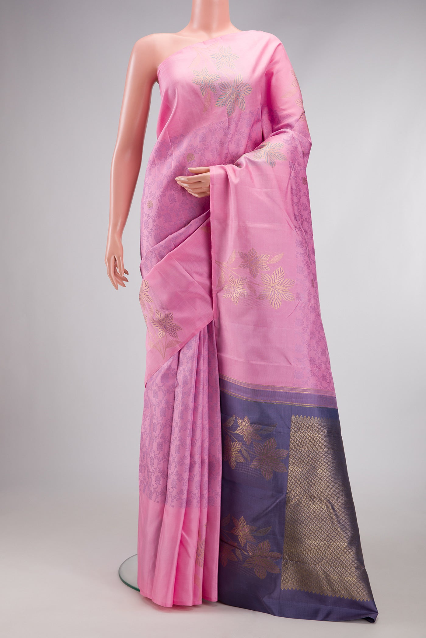 Pink Kanchipuram Silk Saree with Jacquard design on the body and Fancy Border.  displayed on a mannequin