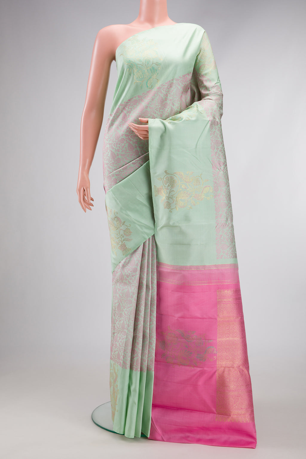 Light Green Kanjivaram Silk Saree with Jacquard design on the body and Fancy Border.  displayed on a mannequin