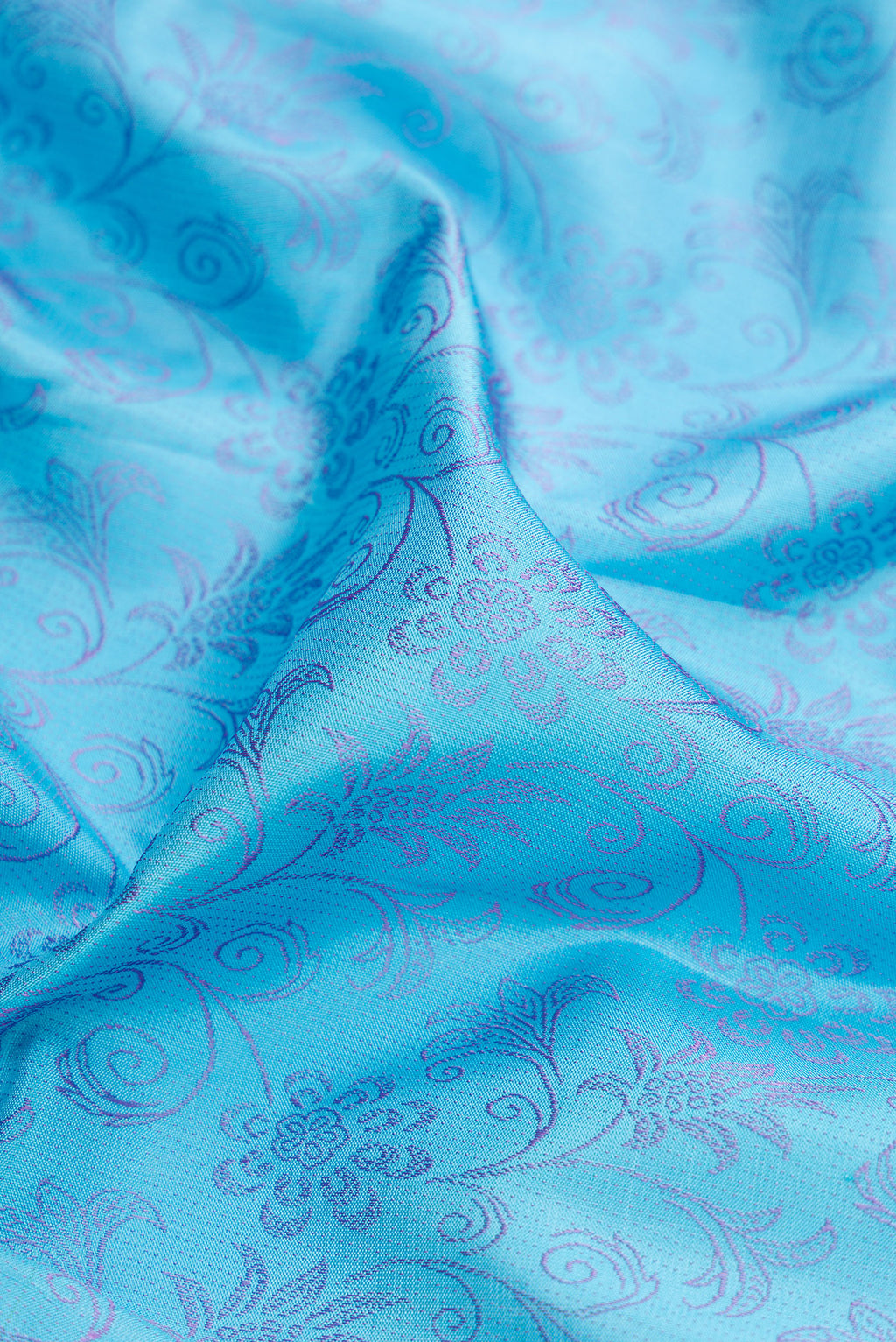 Close up of Sky Blue Kanjivaram Silk Saree with Jacquard design on the body and Fancy Border.  displaying folds