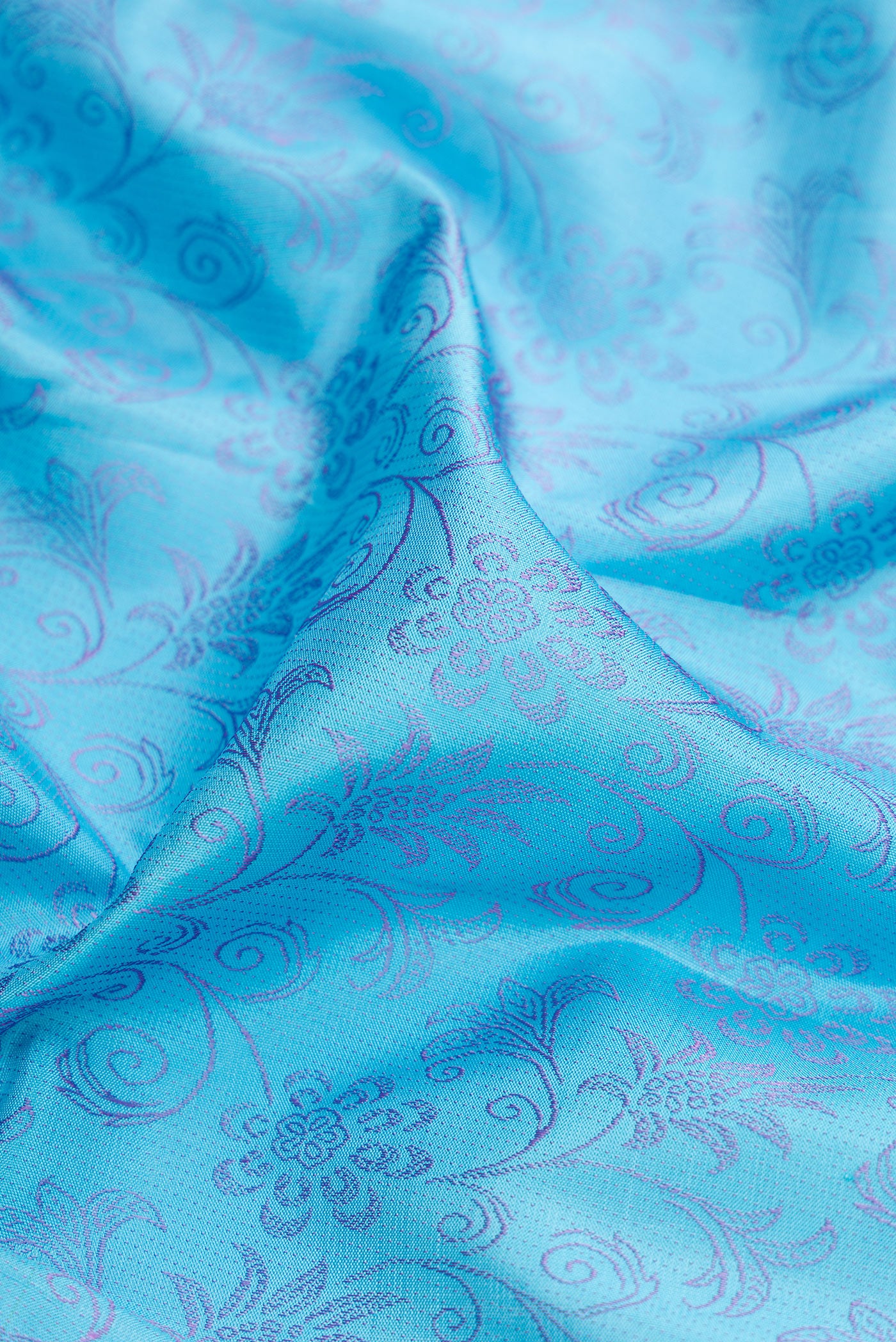 Close up of Sky Blue Kanjivaram Silk Saree with Jacquard design on the body and Fancy Border.  displaying folds