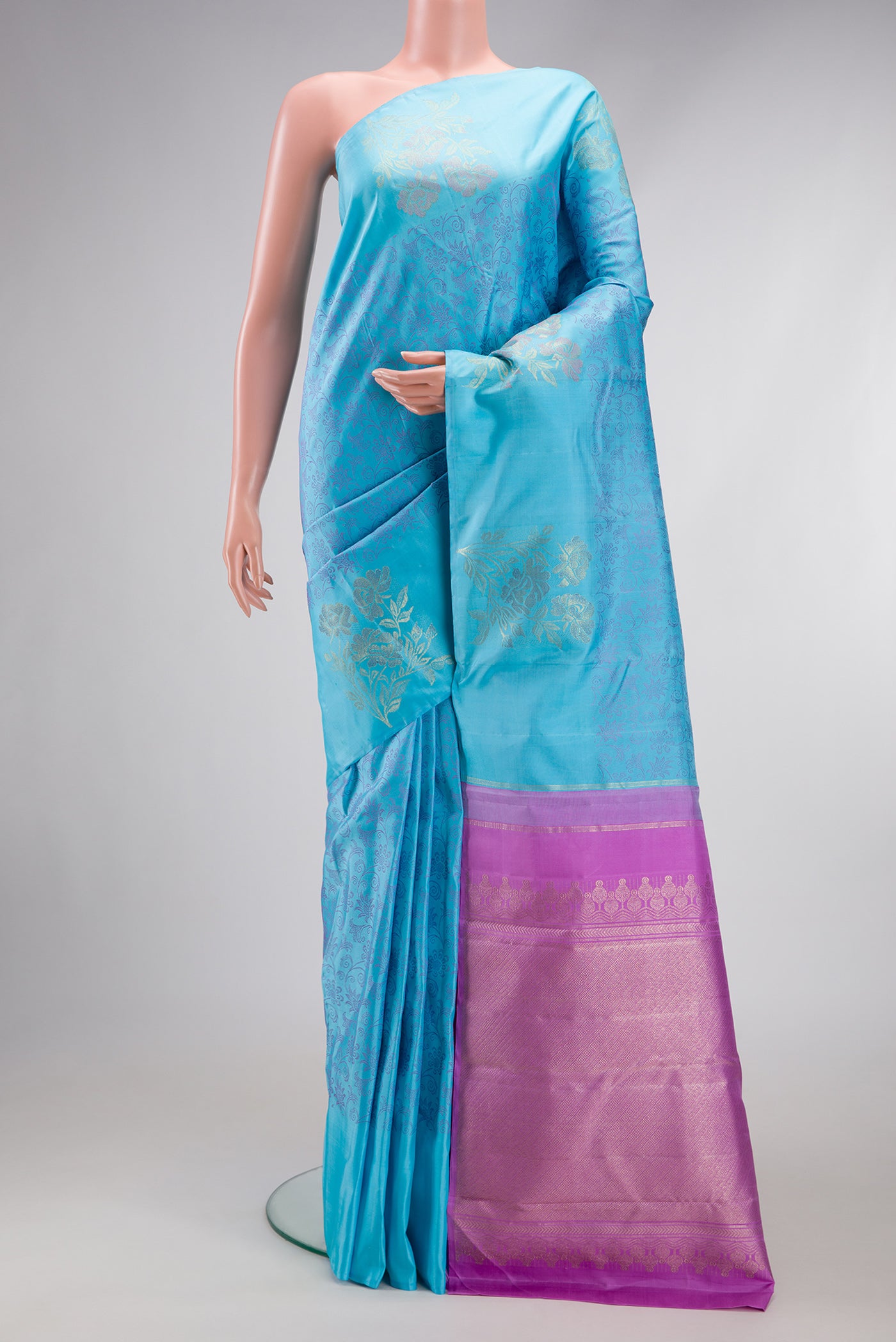 Sky Blue Kanjivaram Silk Saree with Jacquard design on the body and Fancy Border.  displayed on a mannequin