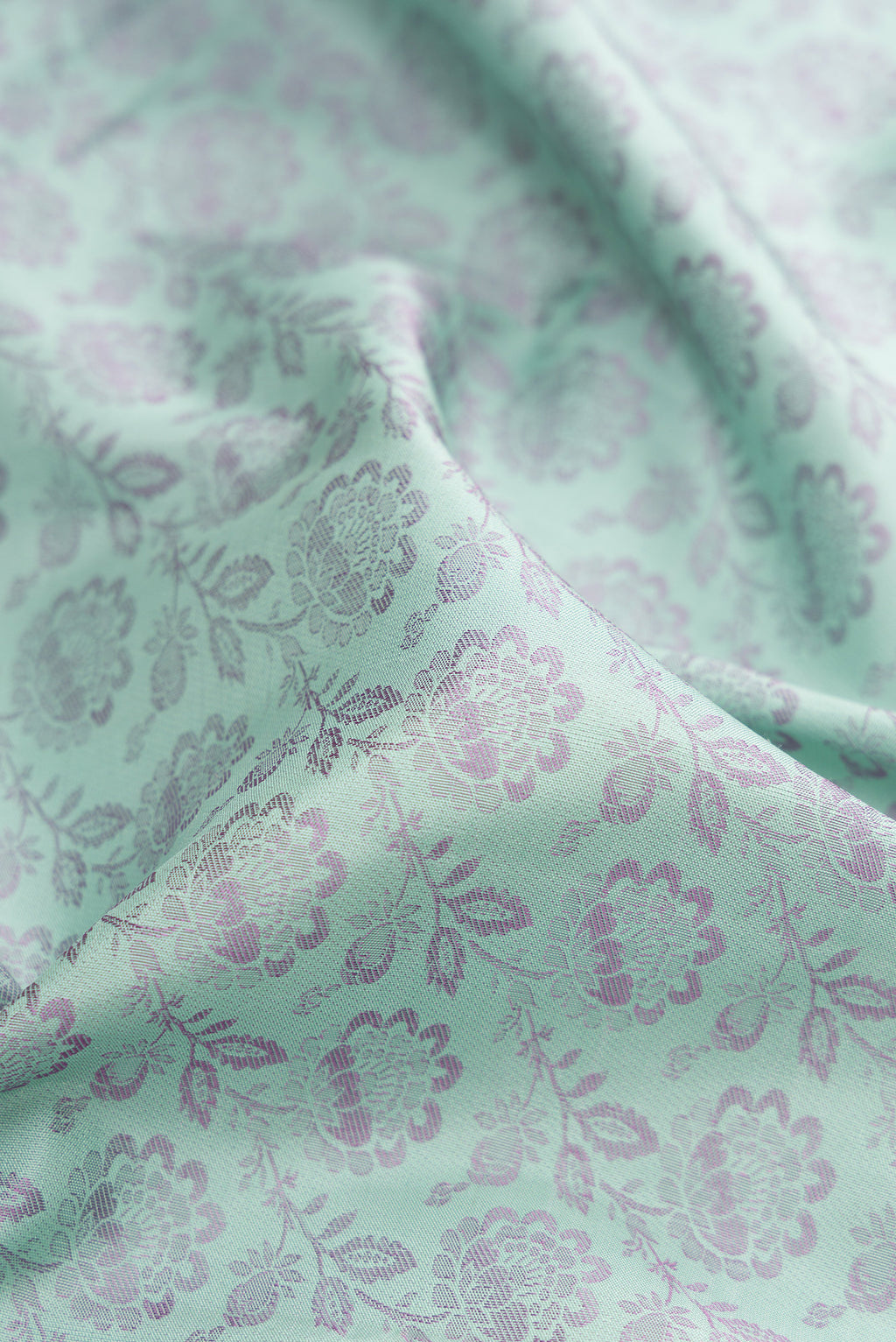 Close up of Light Blue Kanjivaram Silk Saree with Jacquard design on the body and Fancy Border.  displaying folds