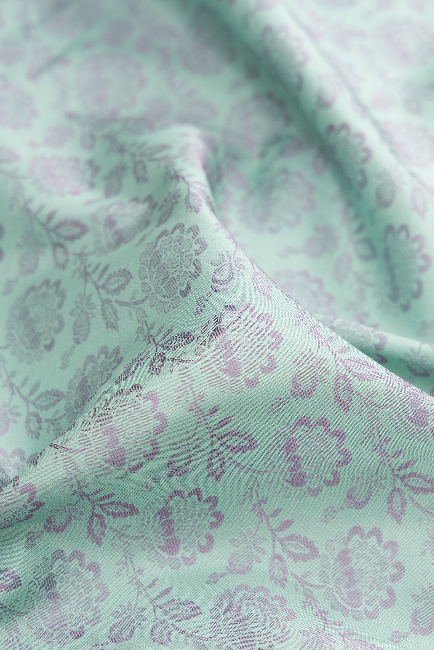 Close up of Light Blue Kanjivaram Silk Saree with Jacquard design on the body and Fancy Border.  displaying folds