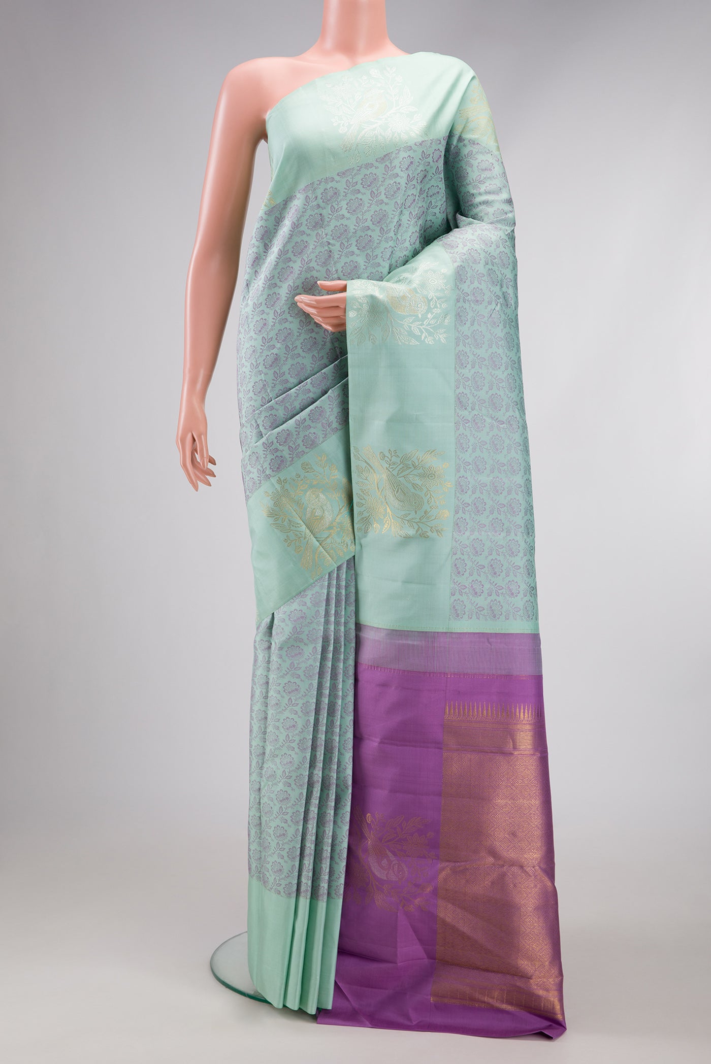 Light Blue Kanjivaram Silk Saree with Jacquard design on the body and Fancy Border.  displayed on a mannequin