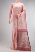 Peach Kanjivaram Silk Saree with Jacquard design on the body and Fancy Border.  displayed on a mannequin