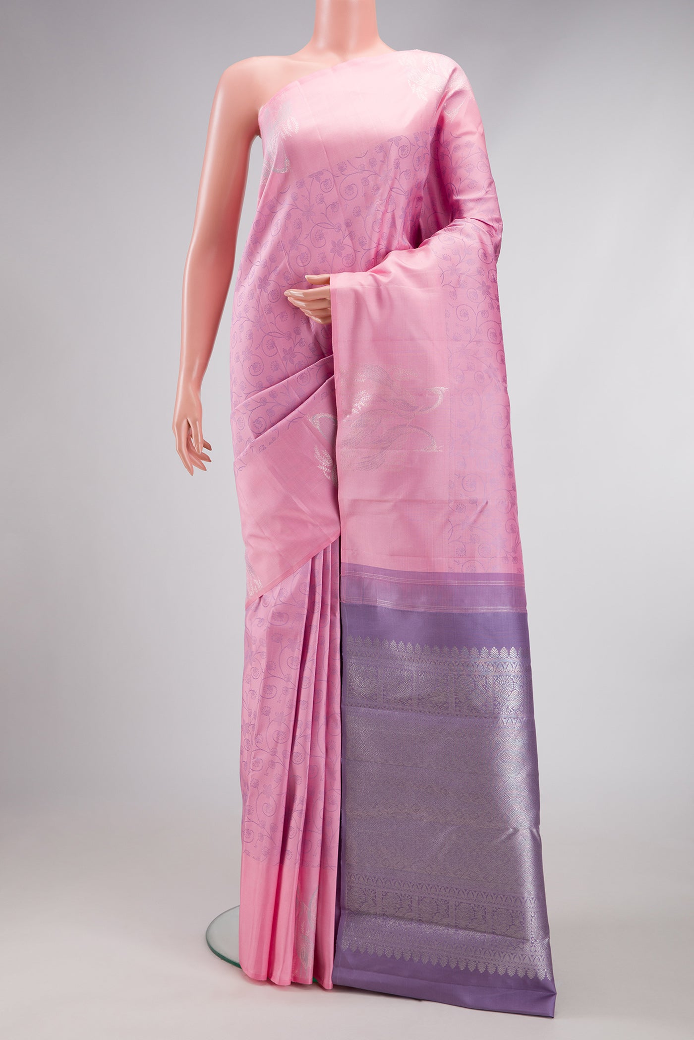 Pink Kanjivaram Silk Saree with Jacquard design on the body and Fancy Border.  displayed on a mannequin