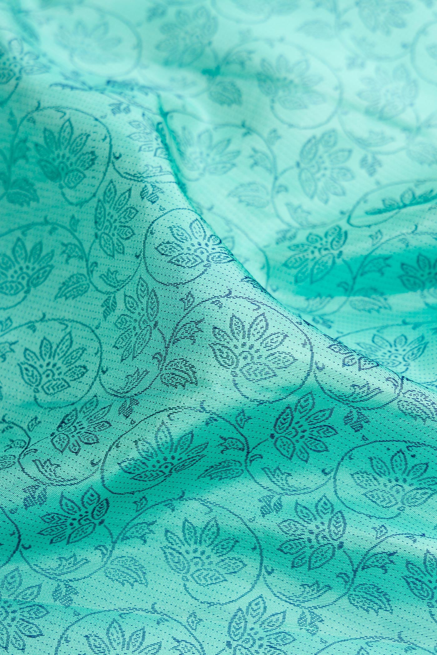 Close up of Sea Green Kanjivaram Silk Saree with Jacquard design on the body and Fancy Border.  displaying folds