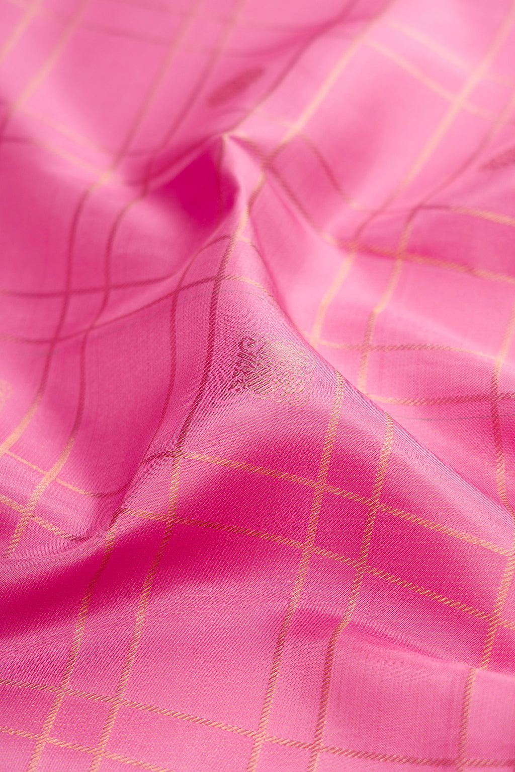 Close up of Rose pink Kanjivaram Silk Saree with Checked design on the body and Zari Border.  displaying folds