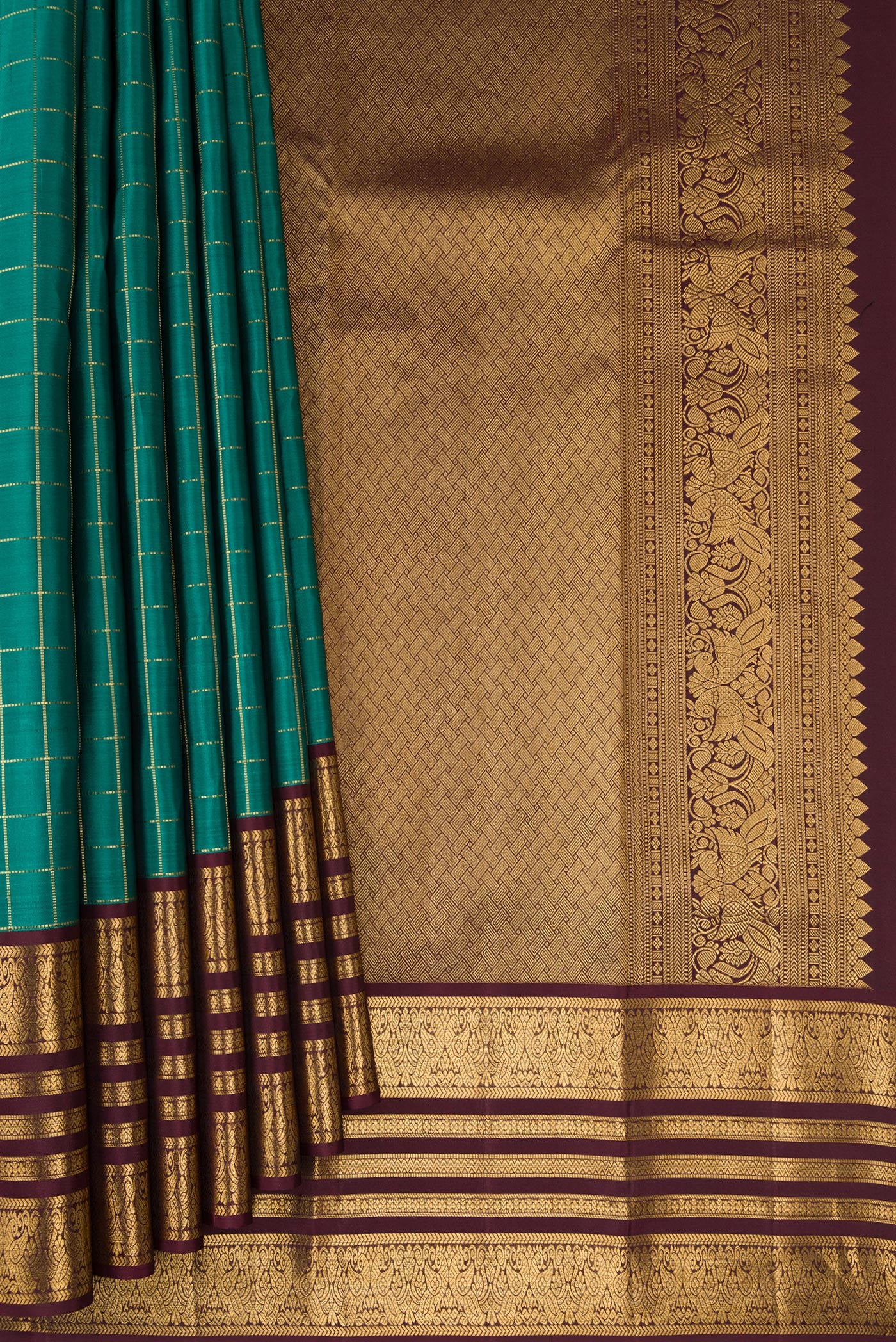 Pleats and pallu of Green Kanjivaram Silk Saree with Checked design on the body and Zari Border. 