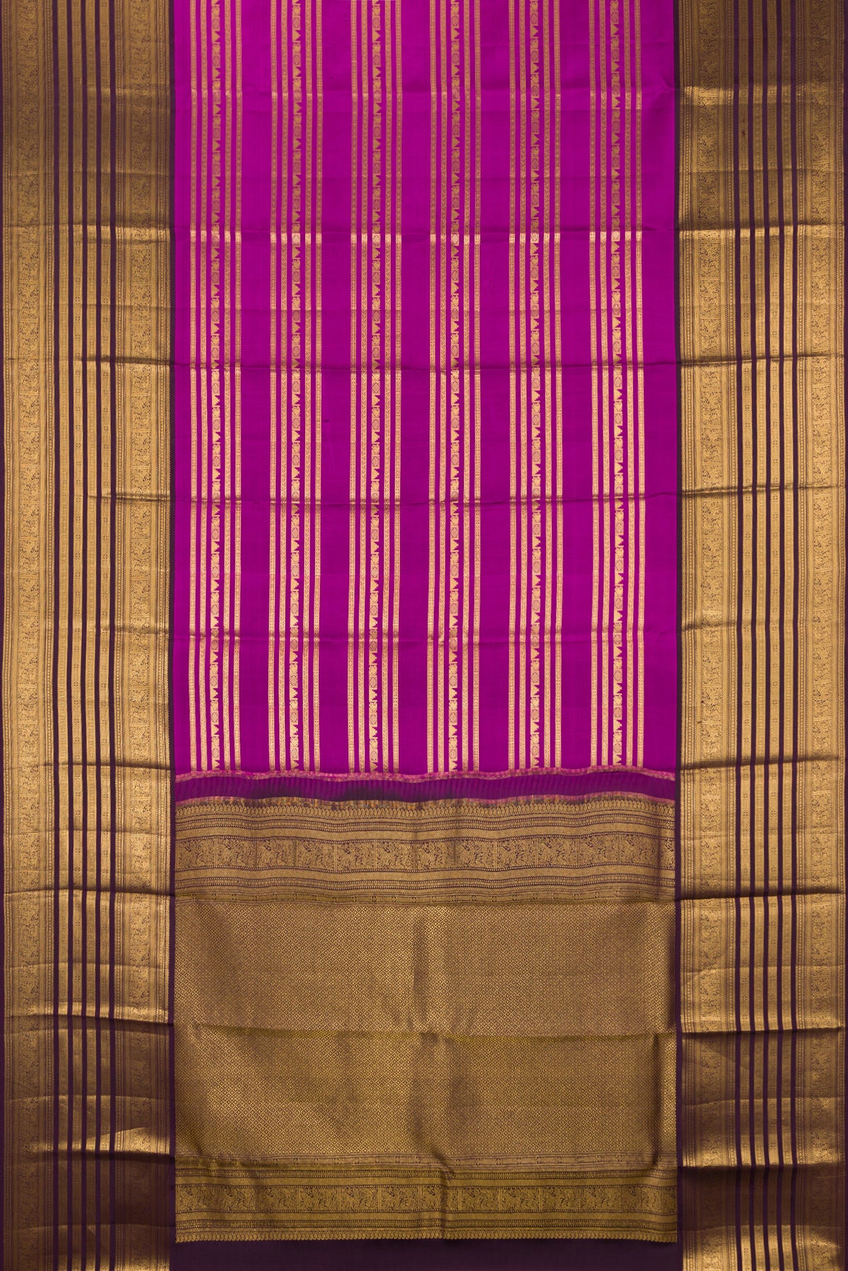 Flat view of Pure Silk Magenta Kanjivaram Saree with Stripes on the body and Fancy Border. 