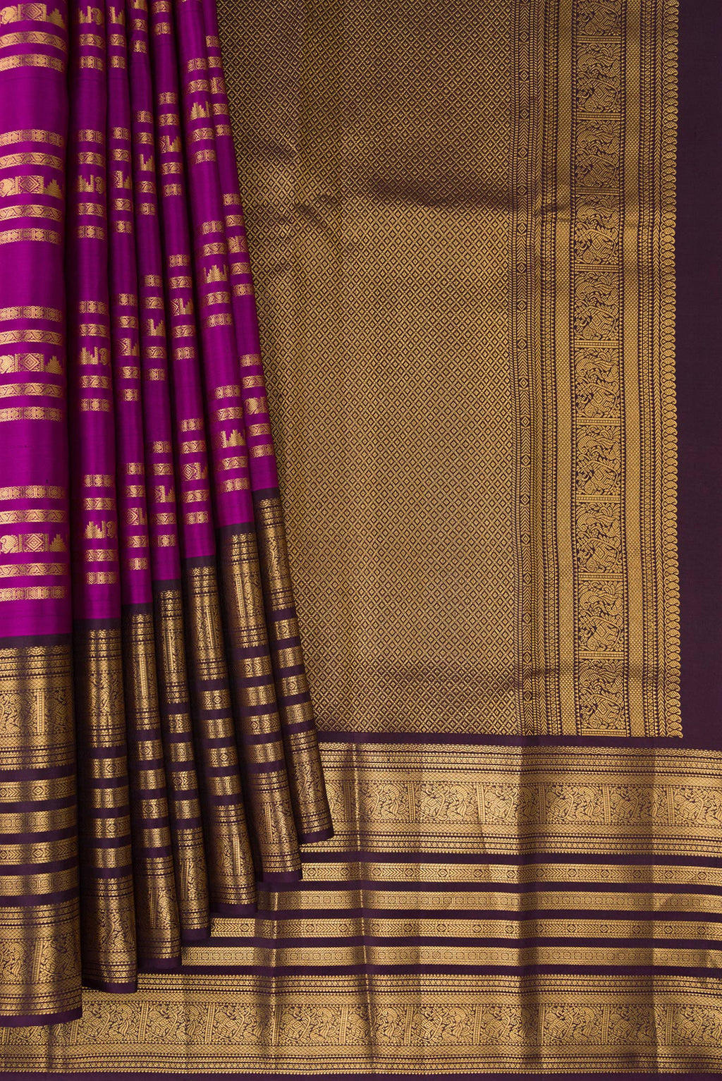 Pleats and pallu of Pure Silk Magenta Kanjivaram Saree with Stripes on the body and Fancy Border. 