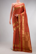 Brick Orange Kanjivaram Silk Saree with Stripes on the body and Zari Border.  displayed on a mannequin