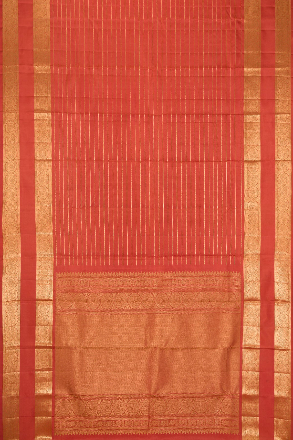 Flat view of Brick Orange Kanjivaram Silk Saree with Stripes on the body and Zari Border. 