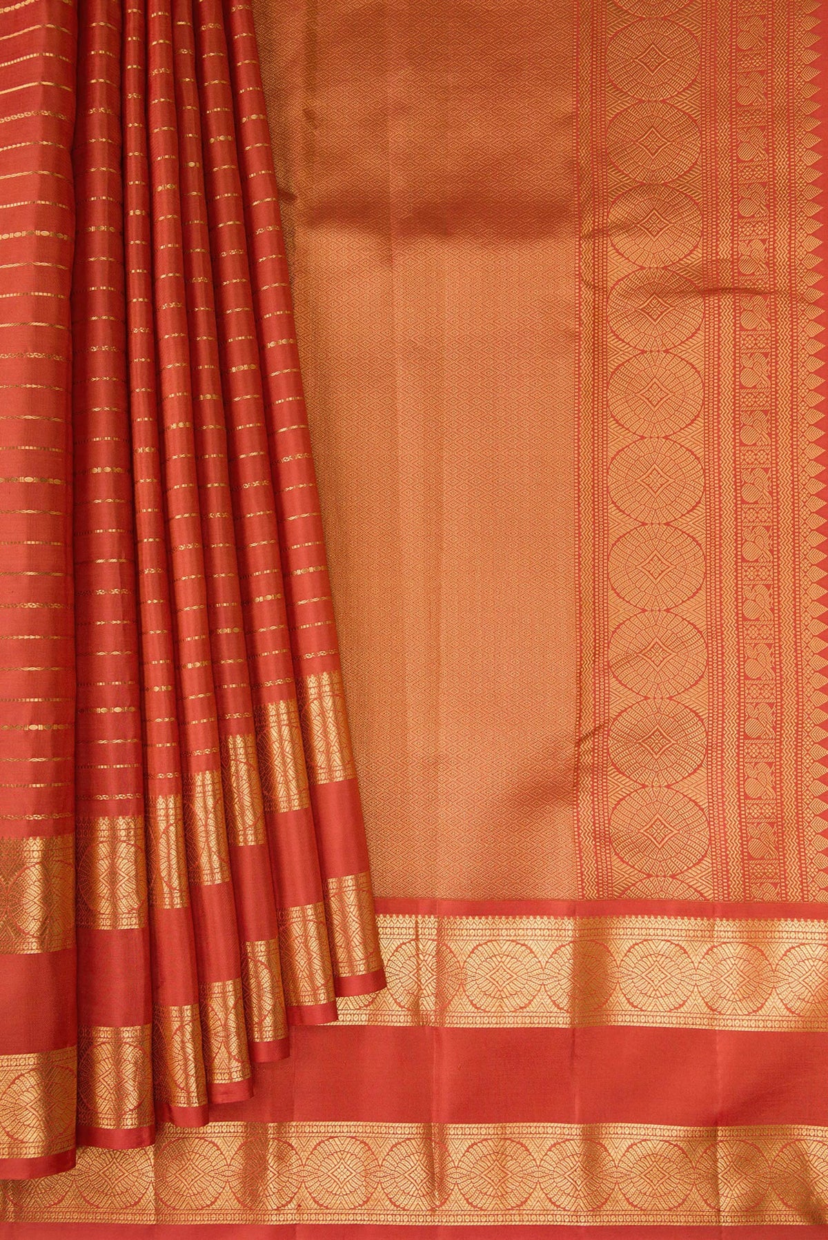 Pleats and pallu of Brick Orange Kanjivaram Silk Saree with Stripes on the body and Zari Border. 