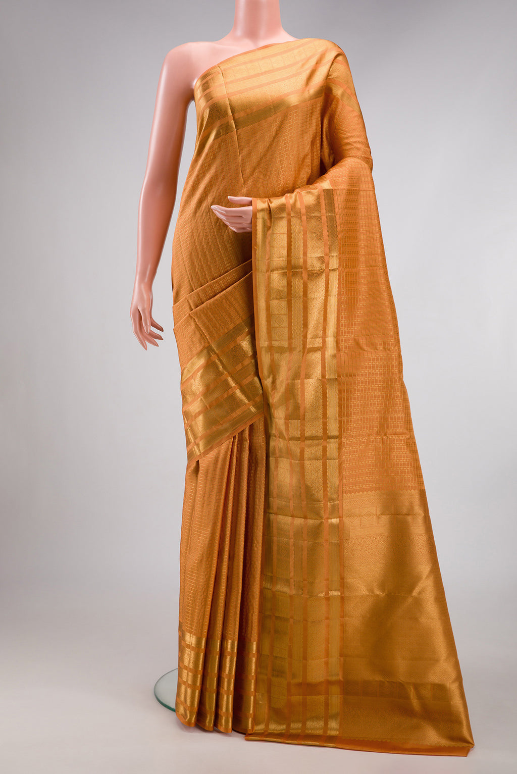 Sandal Kanjivaram Silk Saree with Checked design on the body and Zari Border.  displayed on a mannequin