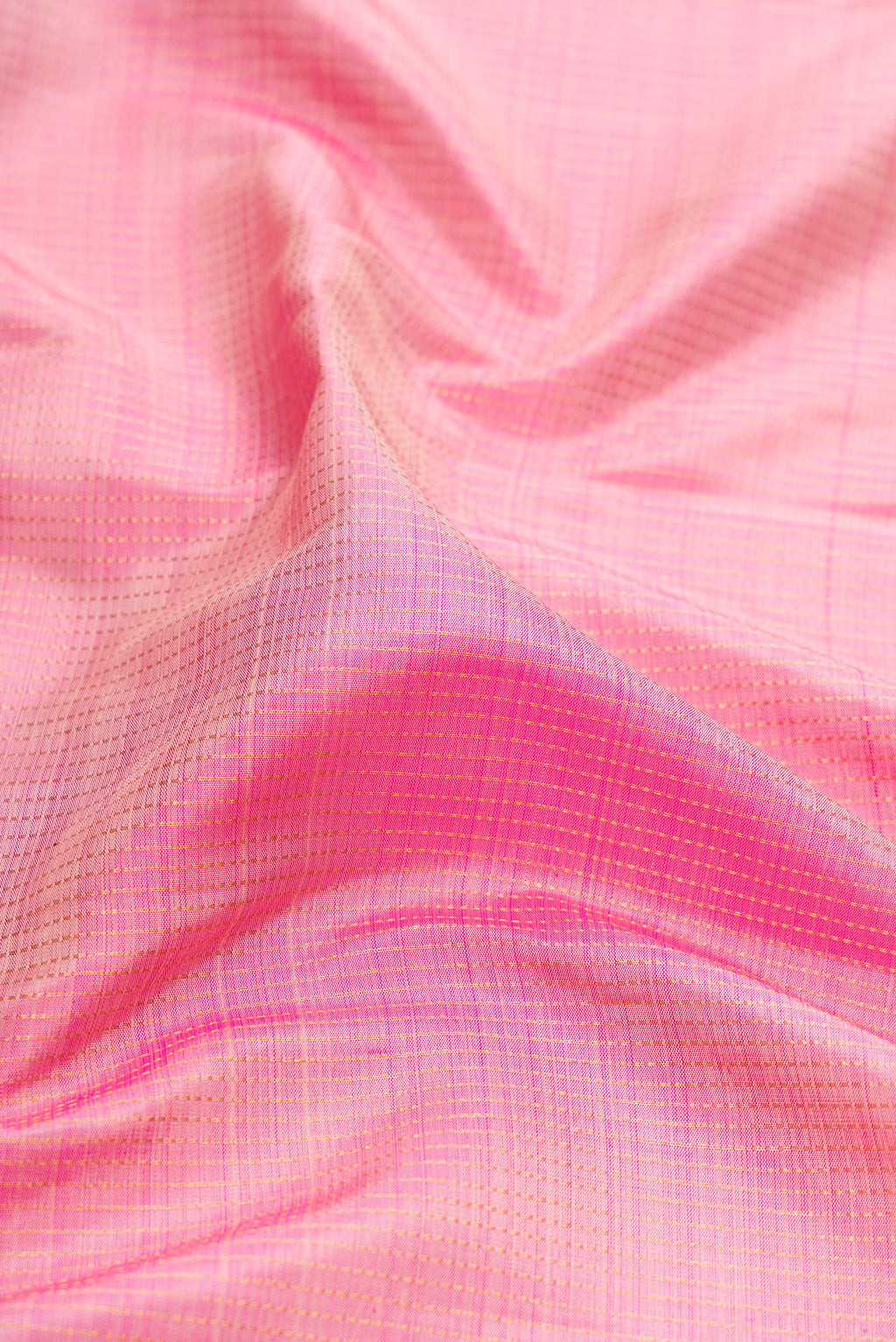 Close up of Rose pink Kanjivaram Silk Saree with Stripes on the body and Zari Border.  displaying folds