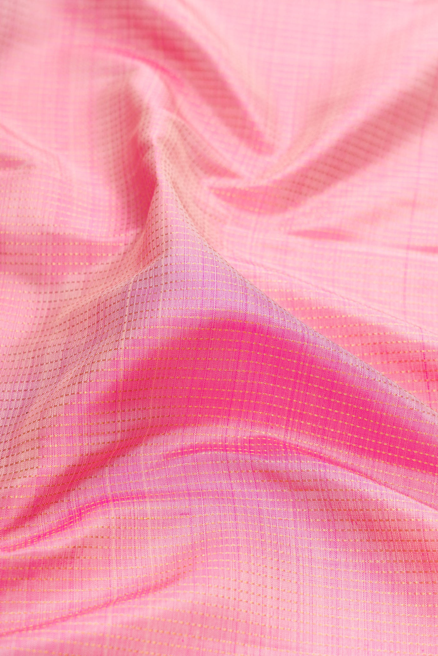 Close up of Rose pink Kanjivaram Silk Saree with Stripes on the body and Zari Border.  displaying folds