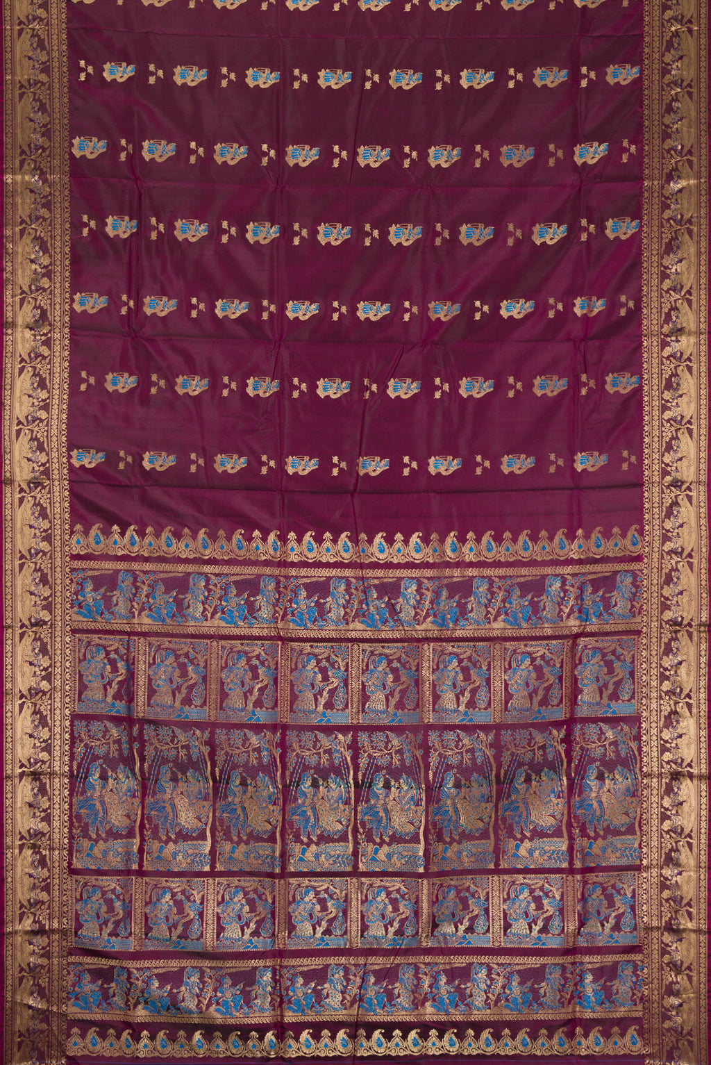 Flat view of Burgundy Baluchari Silk Saree with Zari And Thread Butta on the body and Fancy Border. 