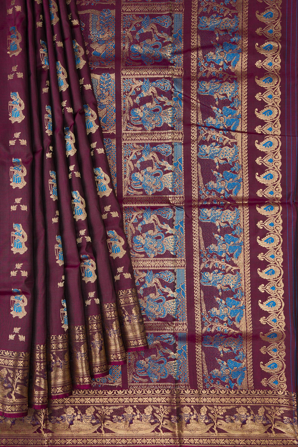 Pleats and pallu of Burgundy Baluchari Silk Saree with Zari And Thread Butta on the body and Fancy Border. 