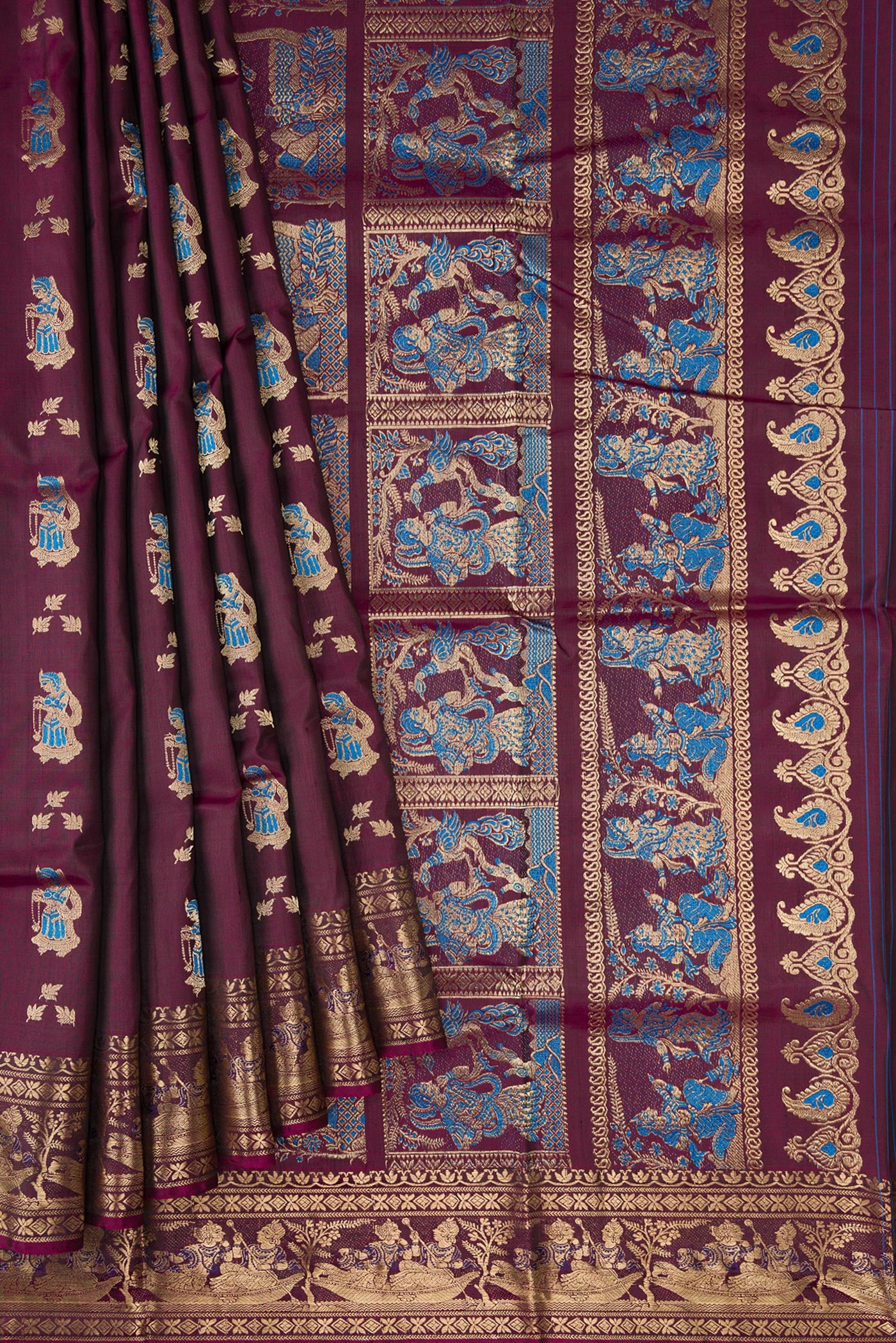 Pleats and pallu of Burgundy Baluchari Silk Saree with Zari And Thread Butta on the body and Fancy Border. 