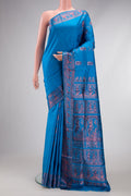 Sky Blue Dual Tone Baluchari Silk Saree with Zari And Thread Butta on the body and Fancy Border.  displayed on a mannequin