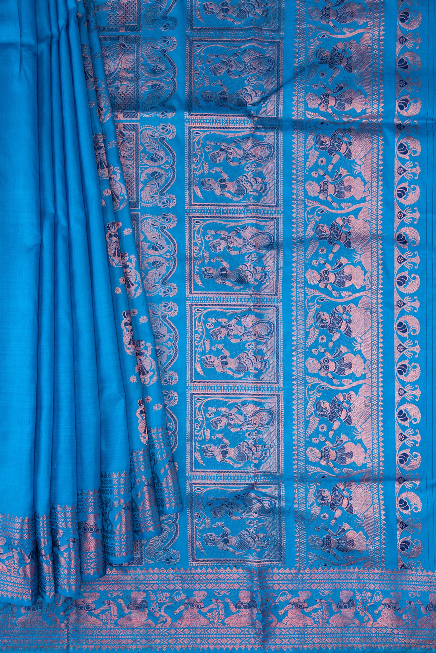 Pleats and pallu of Sky Blue Dual Tone Baluchari Silk Saree with Zari And Thread Butta on the body and Fancy Border. 