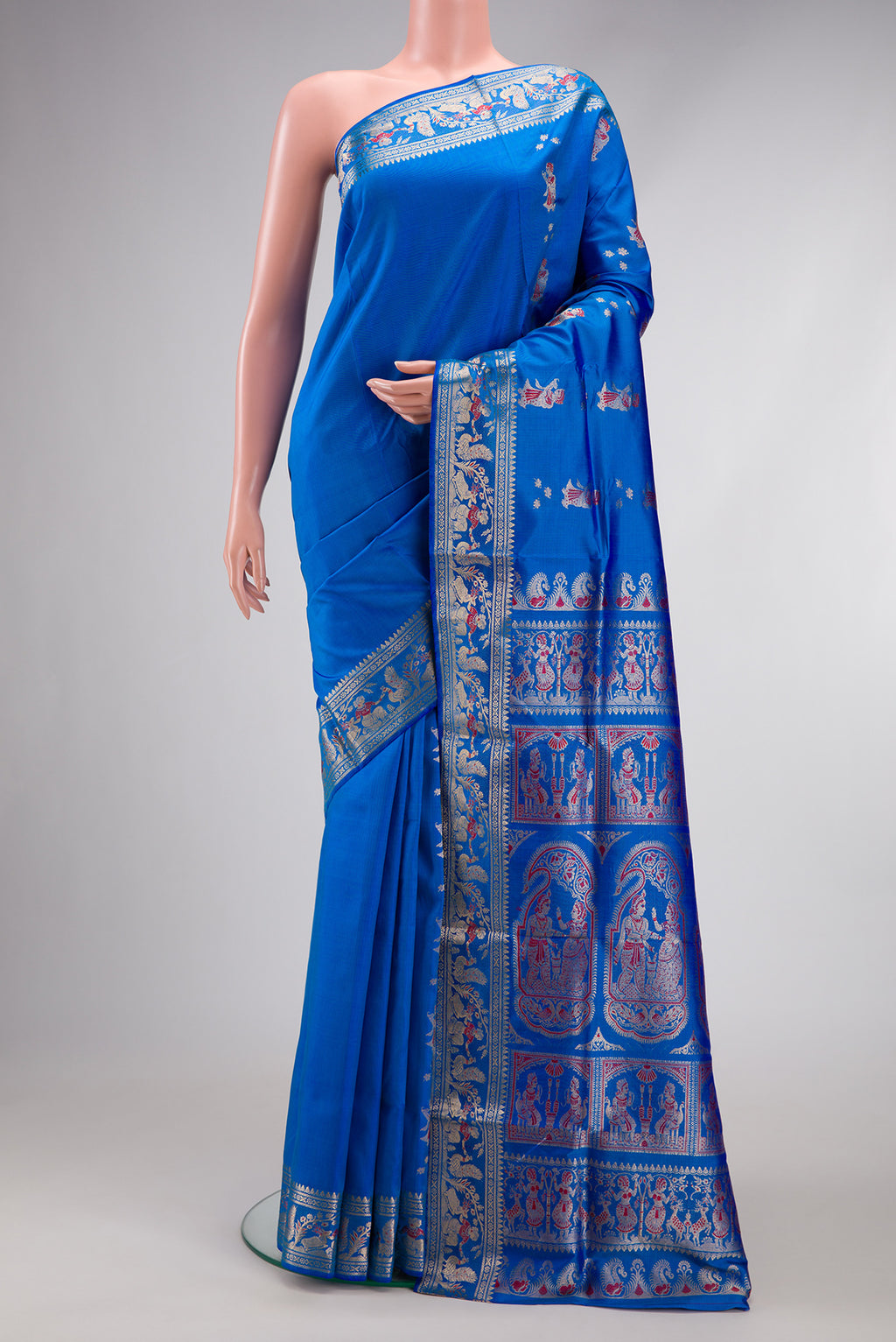 Royal Blue Dual Tone Baluchari Silk Saree with Zari And Thread Butta on the body and Fancy Border.  displayed on a mannequin