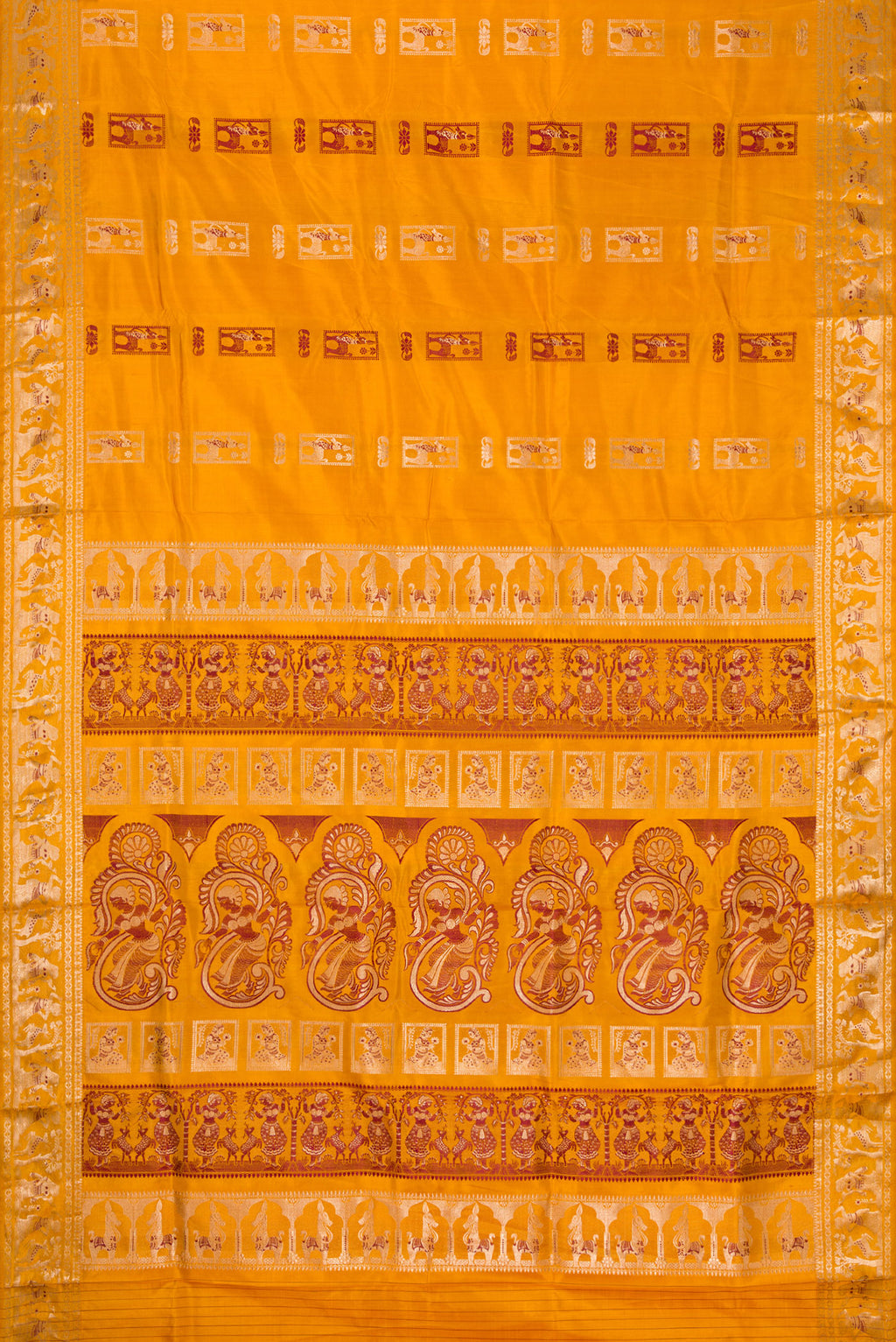 Flat view of Mustard Baluchari Silk Saree with Zari And Thread Butta on the body and Zari Border. 
