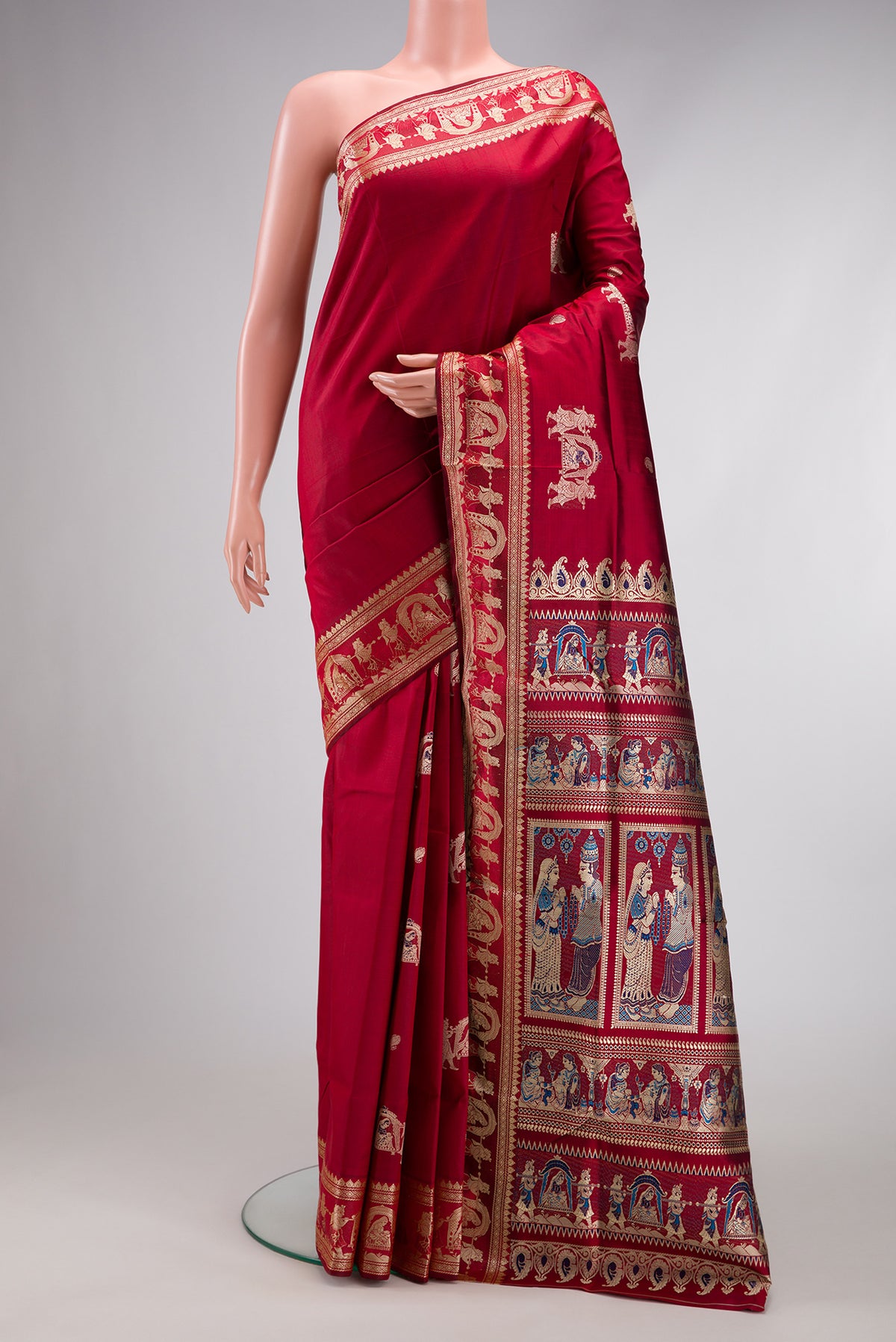 Maroon Baluchari Silk Saree with Thread Butta on the body and Thread Border.  displayed on a mannequin