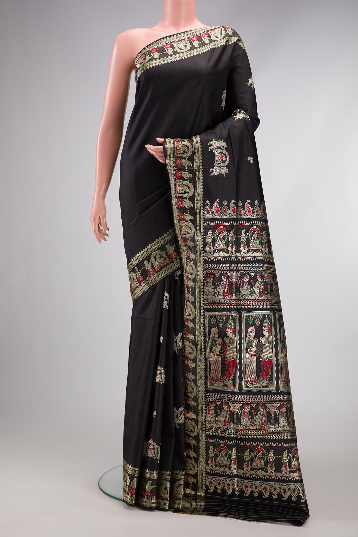 Black Baluchari Silk Saree with Thread Butta on the body and Thread Border.  displayed on a mannequin
