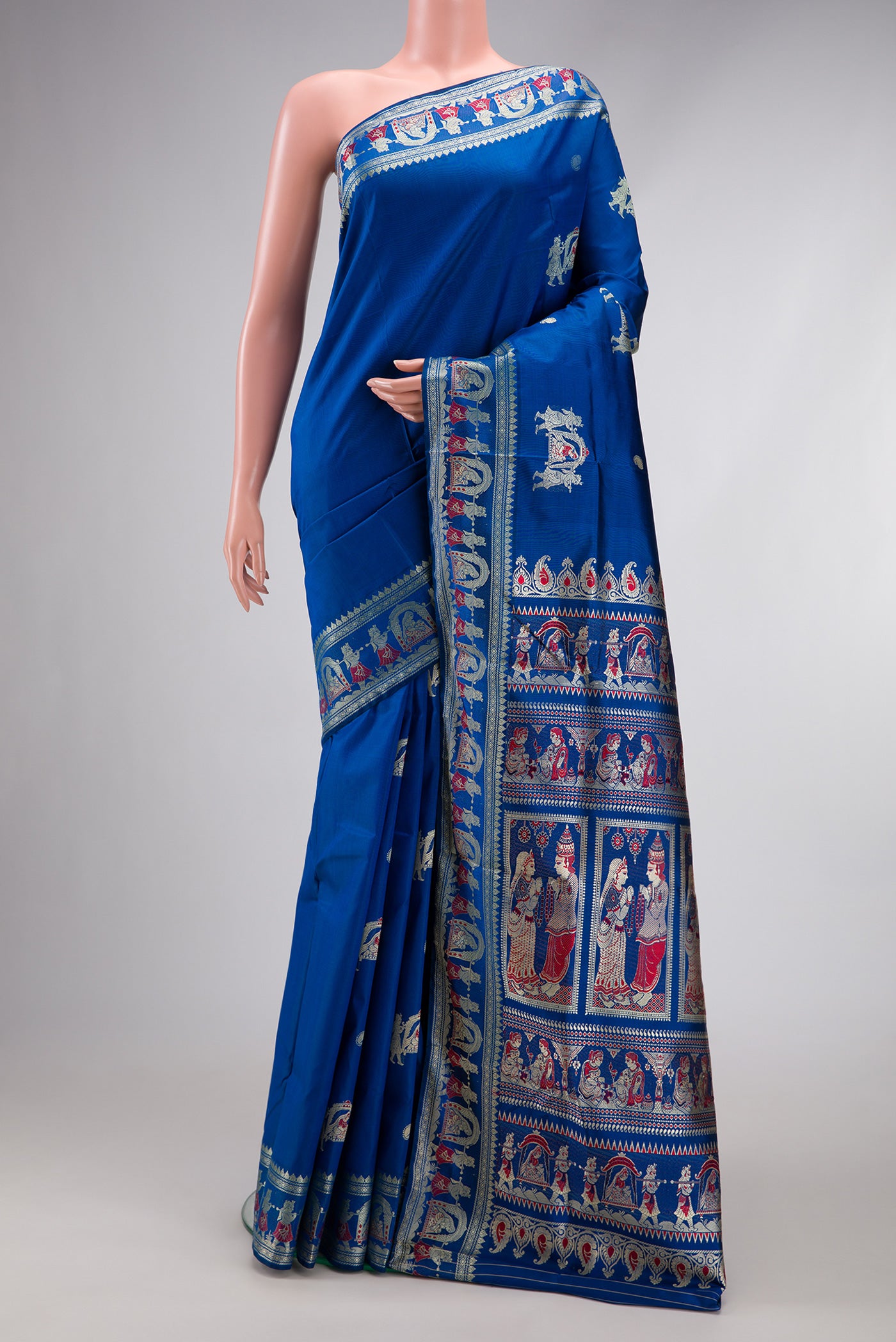 Royal Blue Dual Tone Baluchari Silk Saree with Thread Butta on the body and Thread Border.  displayed on a mannequin