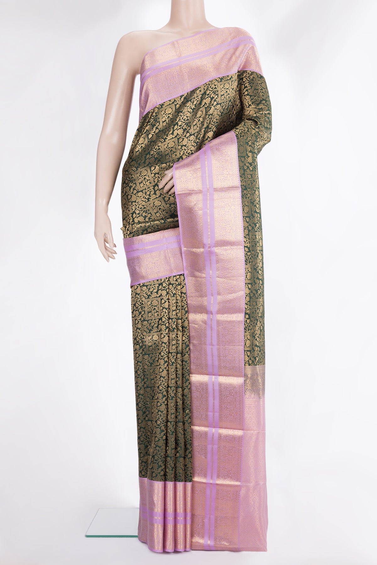 Pure Silk Bottle Green Kanjivaram Saree with Zari Brocade on the body and Zari Border.  displayed on a mannequin