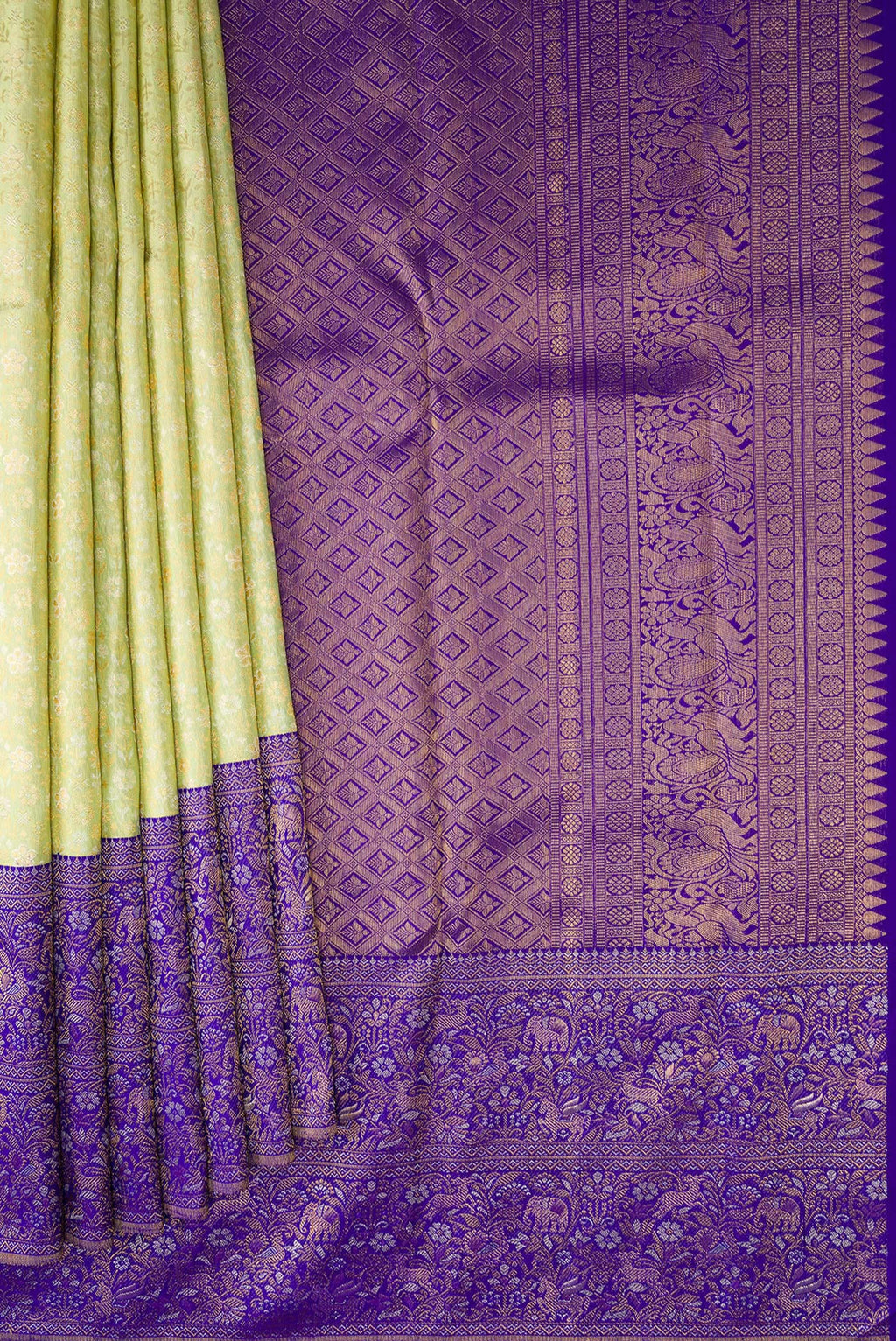 Pleats and pallu of Pista Green Kanjivaram Silk Saree with Zari Brocade on the body and Fancy Border. 