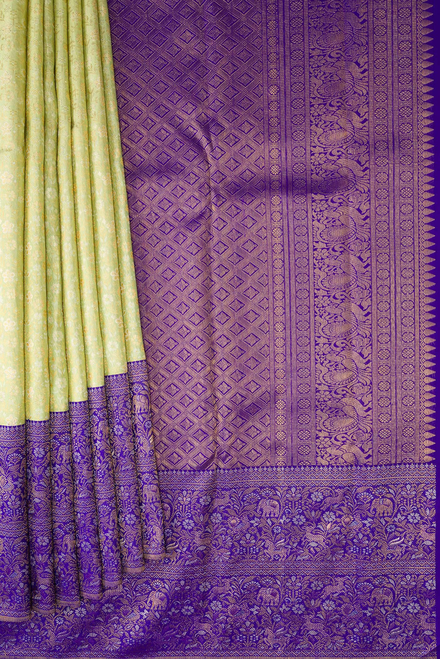 Pleats and pallu of Pista Green Kanjivaram Silk Saree with Zari Brocade on the body and Fancy Border. 