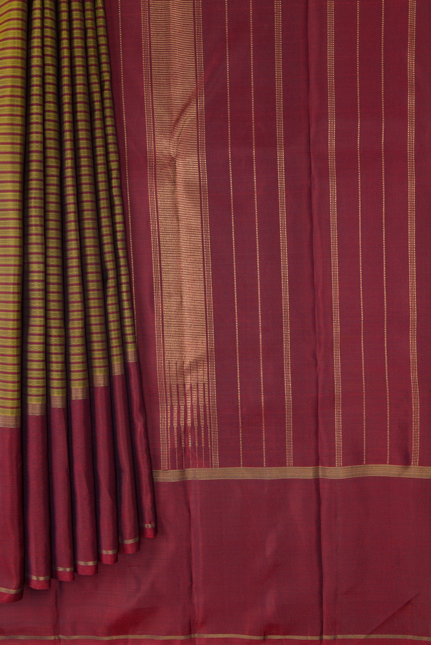 Pleats and pallu of Pure Silk Pure Zari Mehandi Green Kanchipuram Saree with Stripes on the body and Plain Border. 