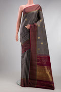 Pure Silk Pure Zari Grey Kanjivaram Saree with Checked design on the body and Zari Border.  displayed on a mannequin