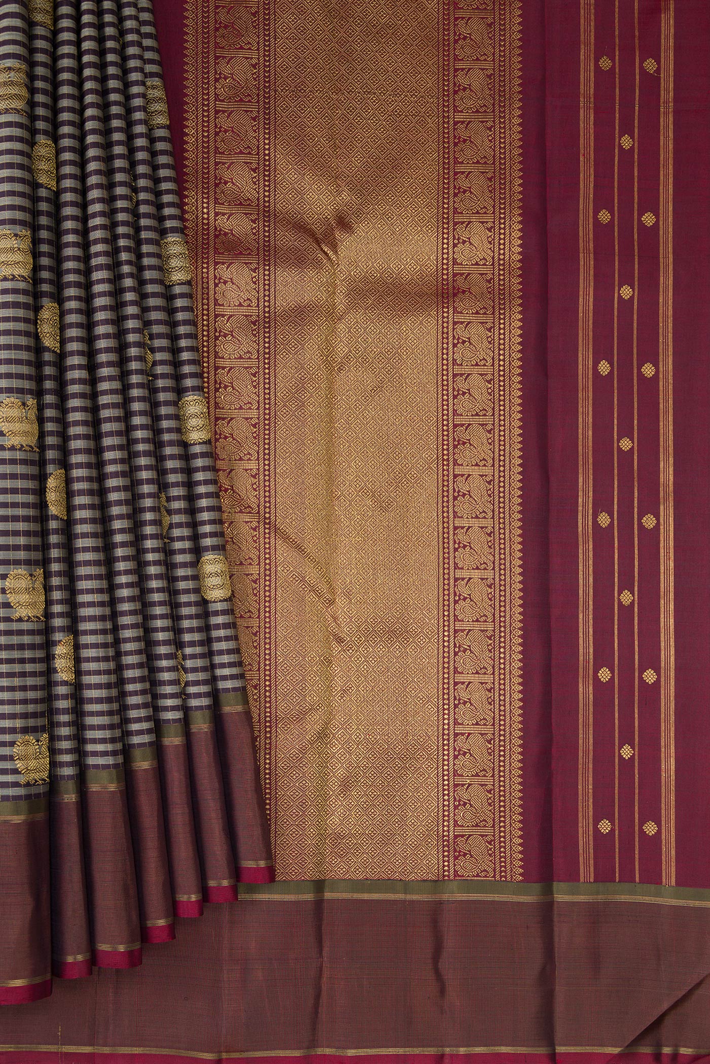 Pleats and pallu of Pure Silk Pure Zari Grey Kanjivaram Saree with Checked design on the body and Zari Border. 