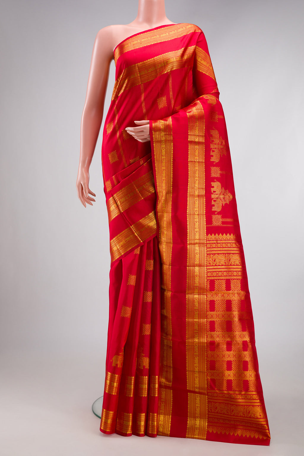 Red Kanjivaram Silk Saree with Zari Butta on the body and Zari Border.  displayed on a mannequin