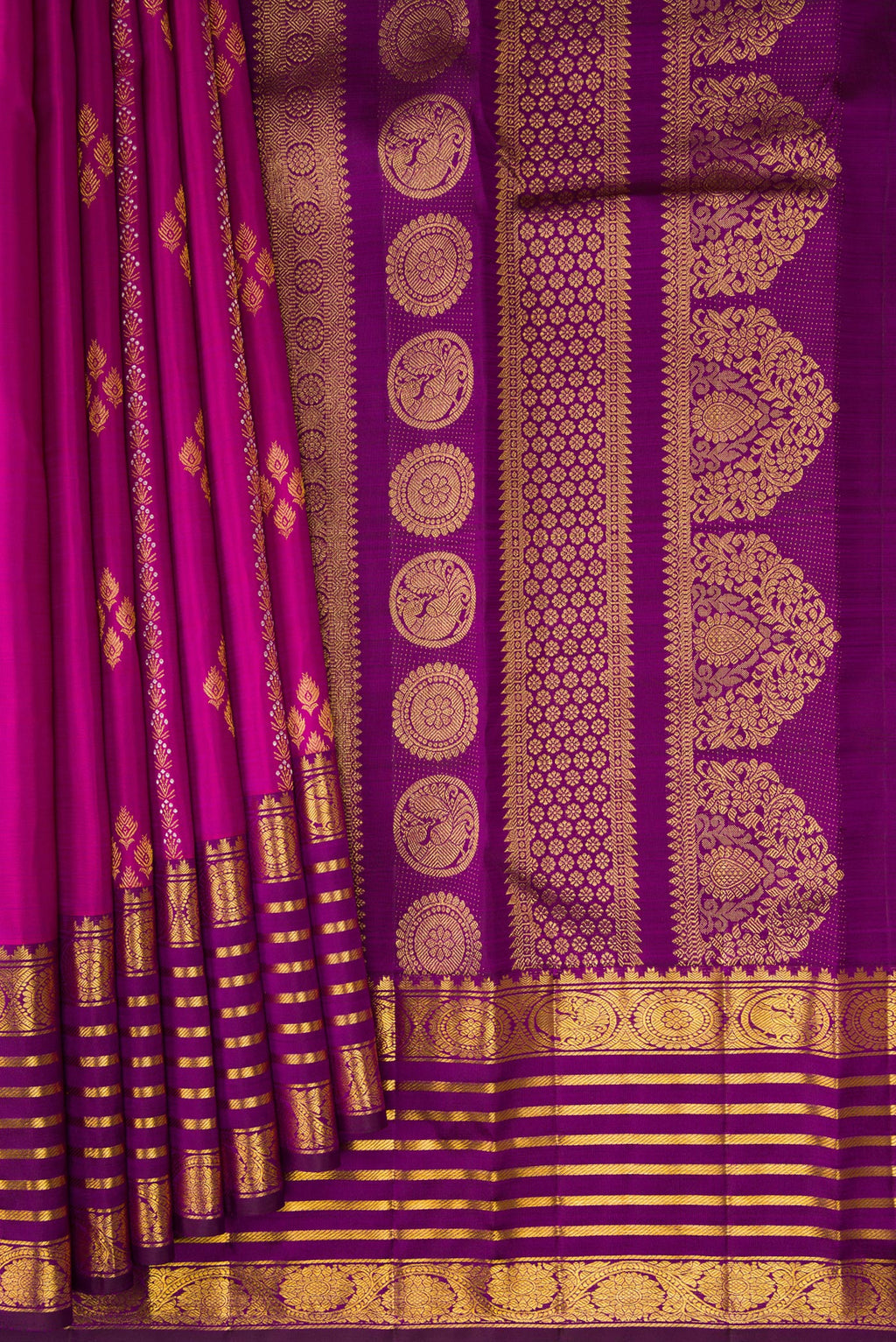 Pleats and pallu of Magenta Kanjivaram Silk Saree with Zari Butta on the body and Zari Border. 