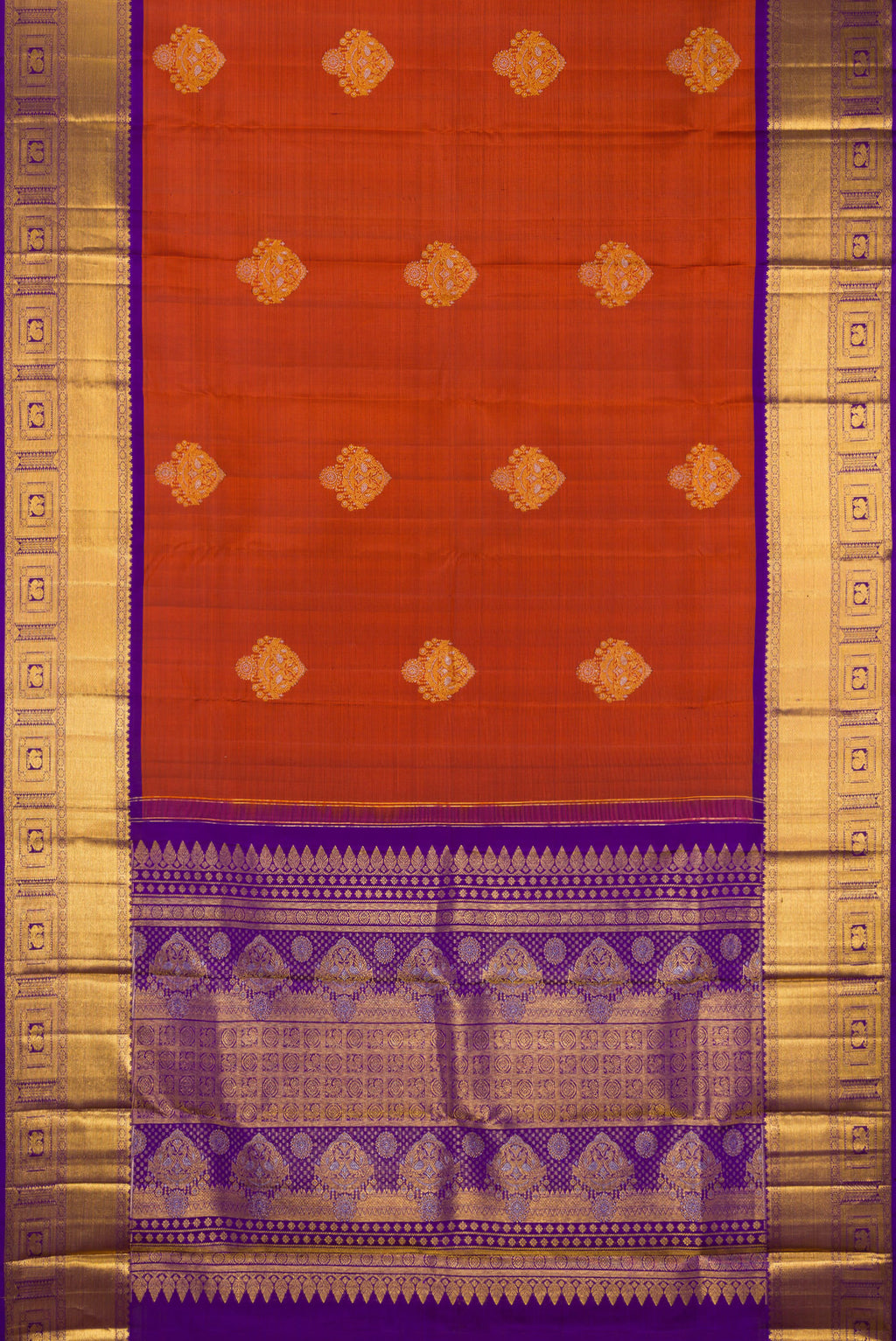 Flat view of Pure Silk Rust Kanjivaram Saree with Zari Butta on the body and Zari Border. 