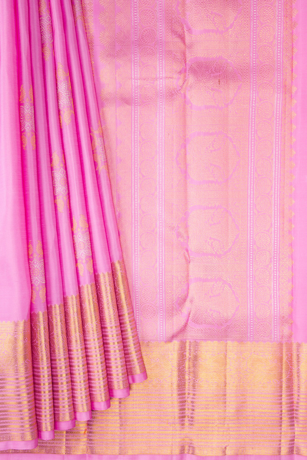 Pleats and pallu of Rose pink Kanjivaram Silk Saree with Zari Butta on the body and Zari Border. 