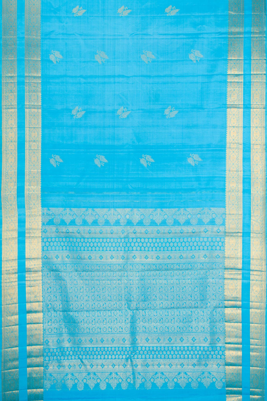 Flat view of Sky Blue Kanjivaram Silk Saree with Zari Butta on the body and Zari Border. 