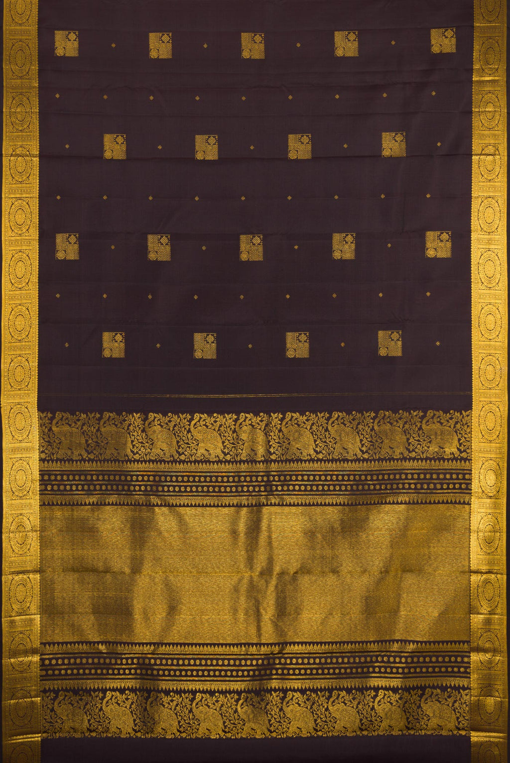 Flat view of Coffee Brown Kanjivaram Silk Saree with Zari Butta on the body and Zari Border. 