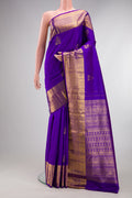 Pure Silk Violet Kanjivaram Saree with Zari Butta on the body and Zari Border.  displayed on a mannequin