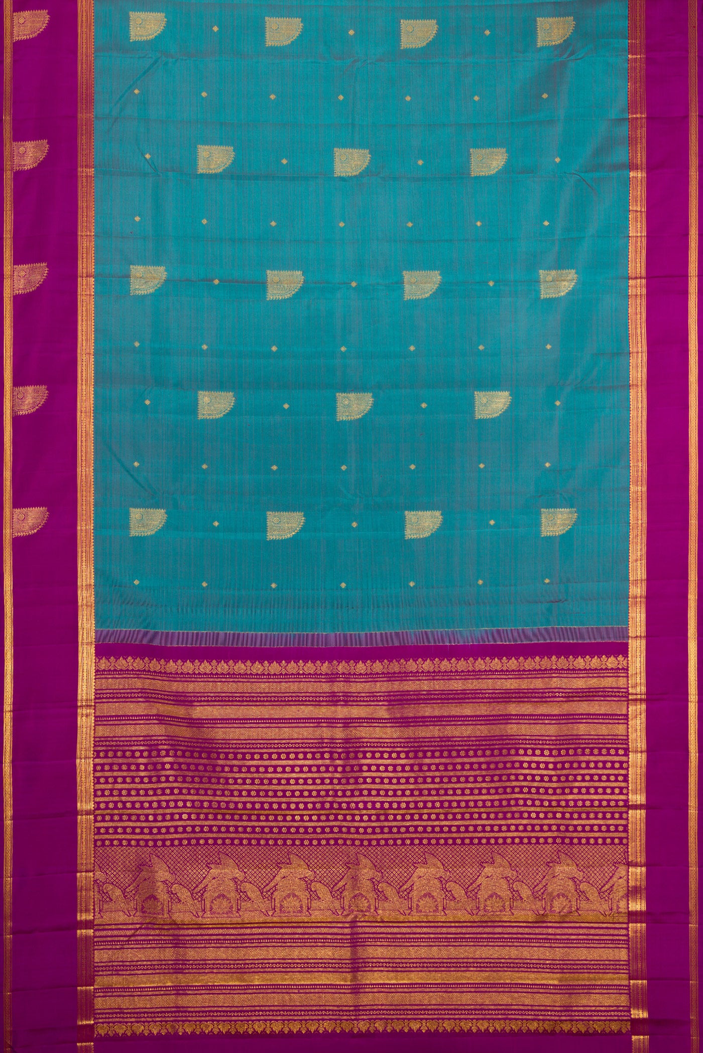 Flat view of Maya Blue Dual Tone Kanjivaram Silk Saree with Zari Butta on the body and Zari Border. 