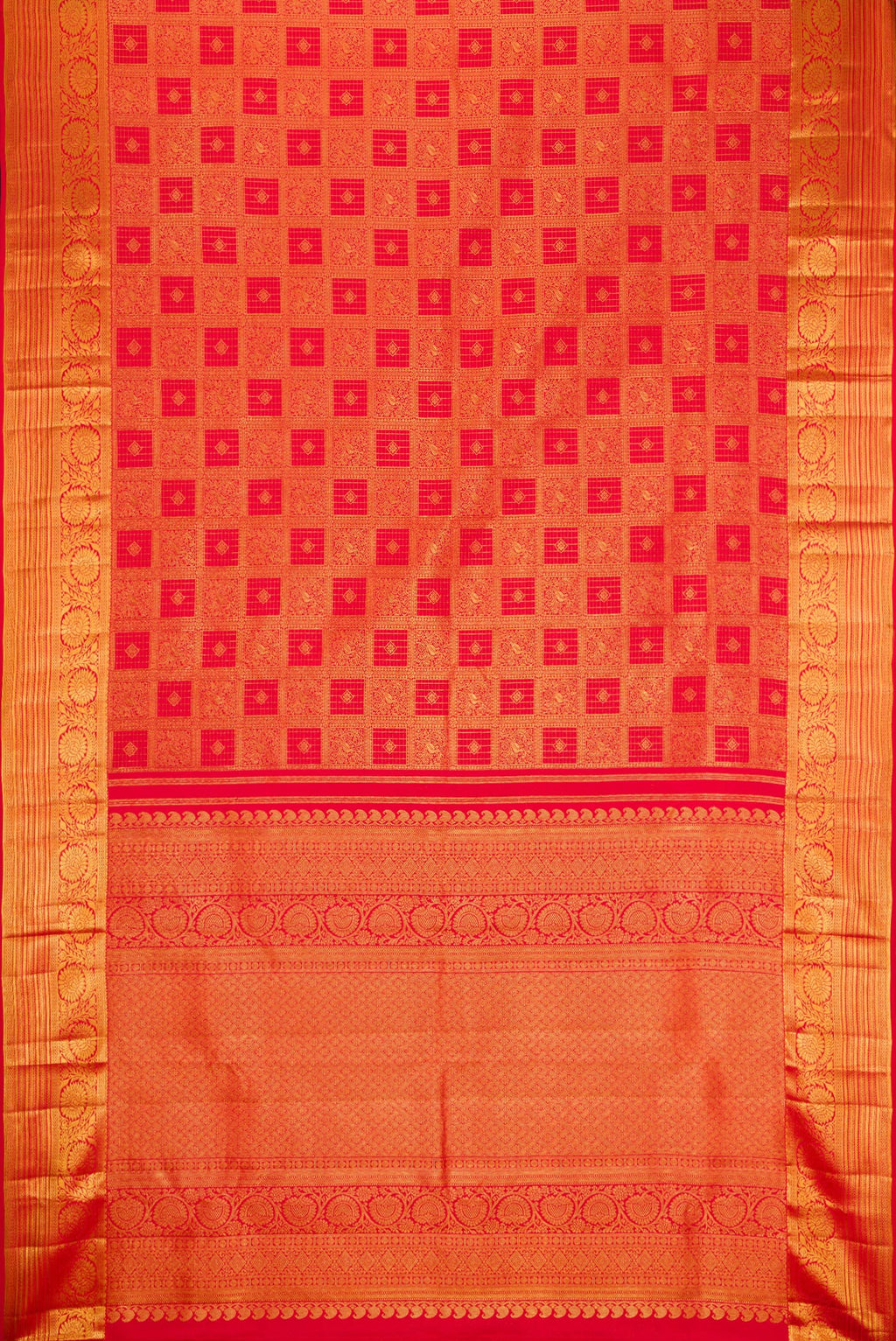 Flat view of Red Kanchipuram Silk Saree with Zari Brocade on the body and Zari Border. 