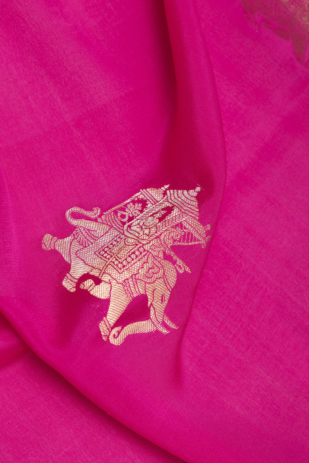 Close up of Dark Pink Mysore Silk Saree with Zari Butta on the body and Zari Border.  displaying folds