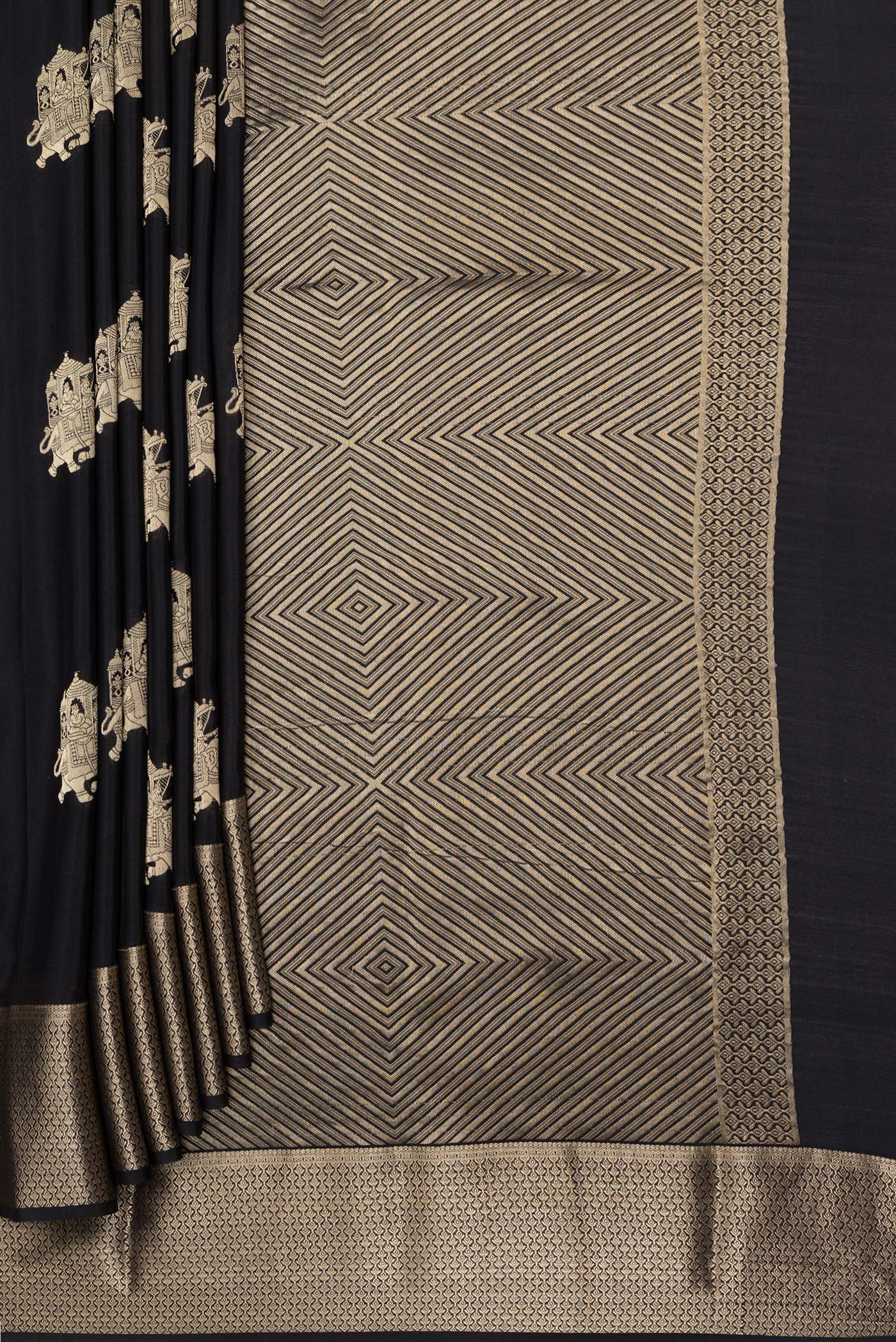 Pleats and pallu of Black Mysore Silk Saree with Zari Butta on the body and Zari Border. 