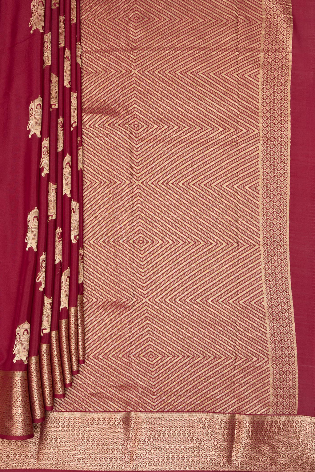 Pleats and pallu of Maroon Mysore Crepe Saree with Zari Butta on the body and Zari Border. 